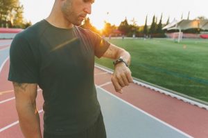 How Long Does It Take to Become an Athletic Trainer? - man looking at his watch