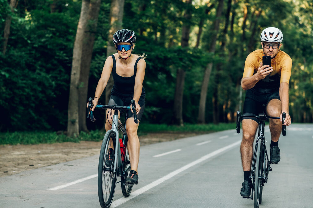 Is Cycling 70 Miles a Week Good for Weight Loss?-couples riding on a tarred road