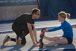 How Long Does It Take to Become an Athletic Trainer? - trainer having a session with athlete