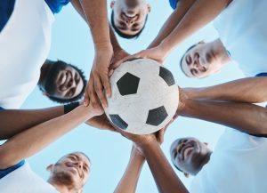 sports facts: peopleholding soccer ball