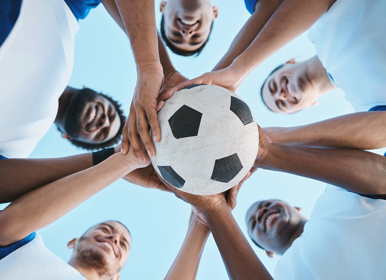 Why is soccer the best sport? - a team of players circling around a ball