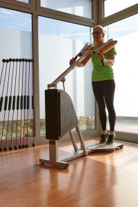 exercise machines - lady standing calf building machine