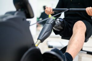 exercise machines - disabled athlete on a rowing machine