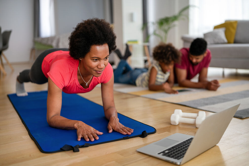 Workout on fatigue mat - woman working out at home