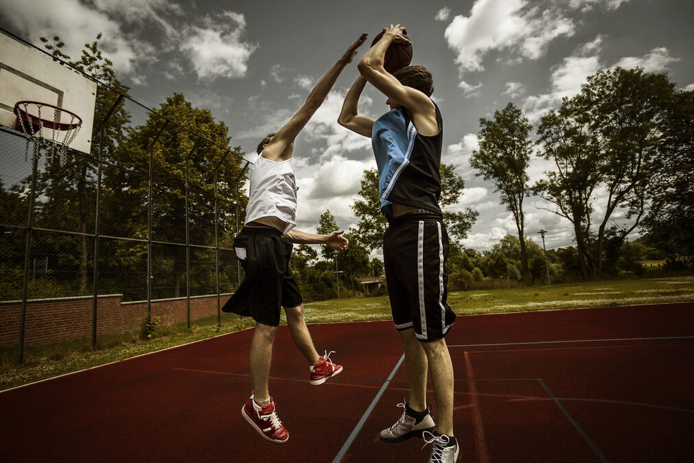 Reflex Before Workout - 2 boys in a basketball duel